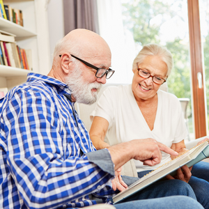 An older couple reading together
