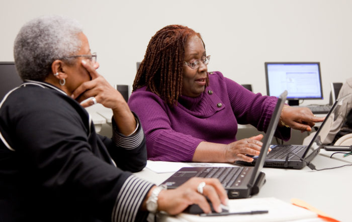 Two women working on a computer