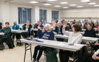Group of people in town hall meeting