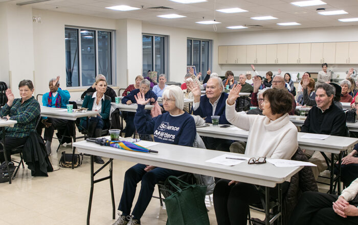 Group of people in town hall meeting