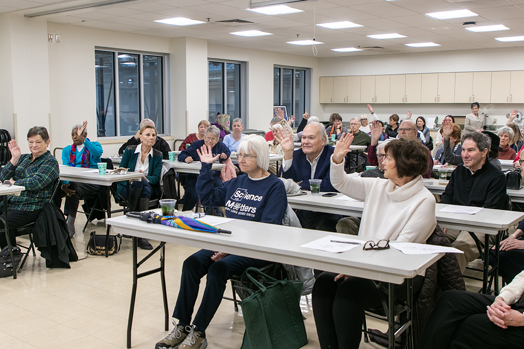 Group of people in town hall meeting